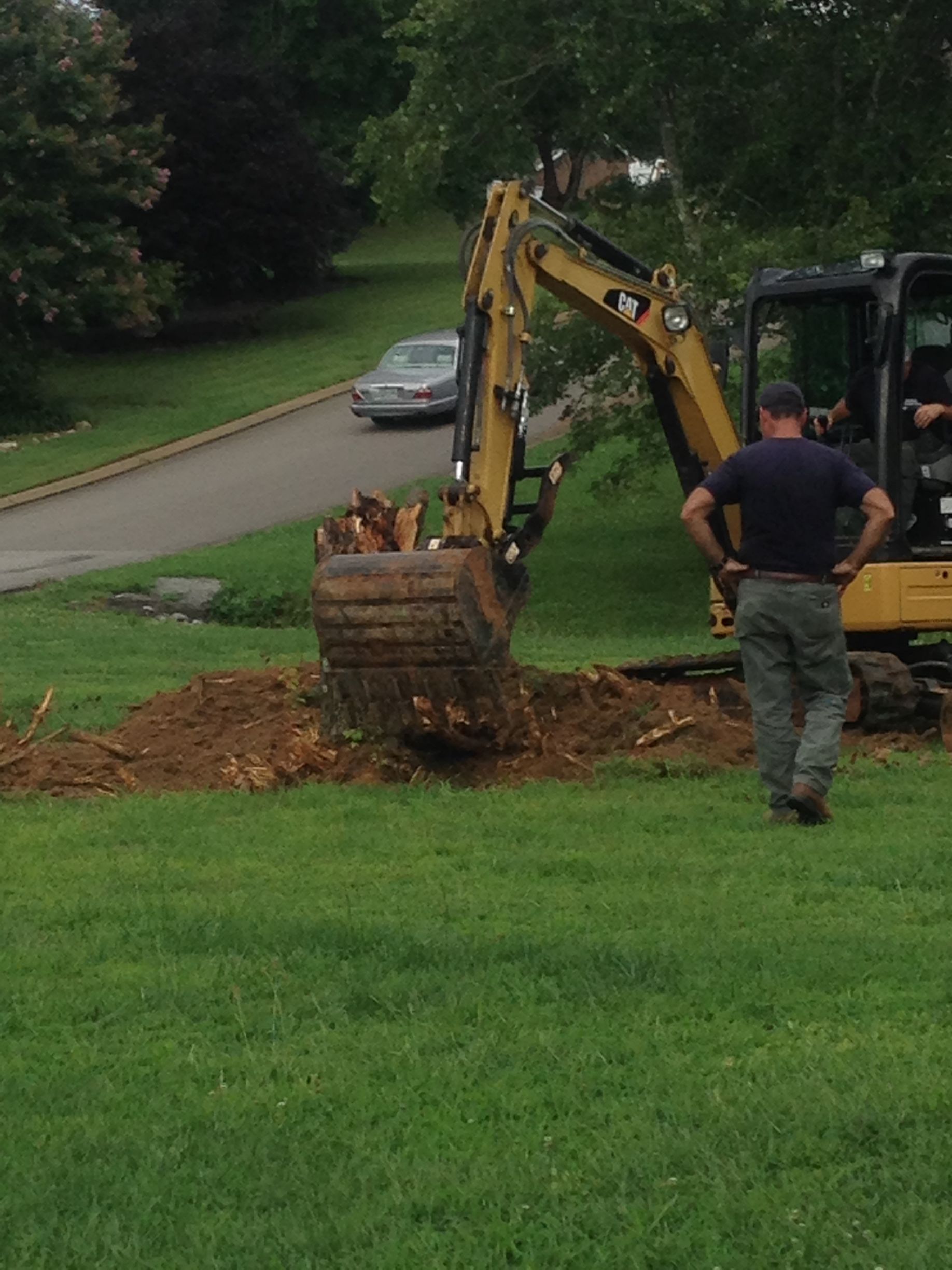 A Person In A Blue Shirt And Black Gloves — Chattanooga, TN — Roto-Rooter