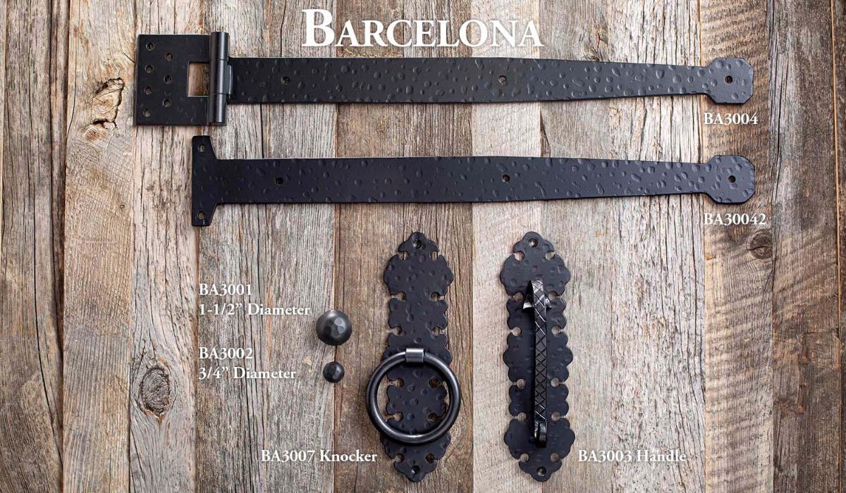 Rustic wood board with black metal door hardware pieces and the word “Barcelona” at top.