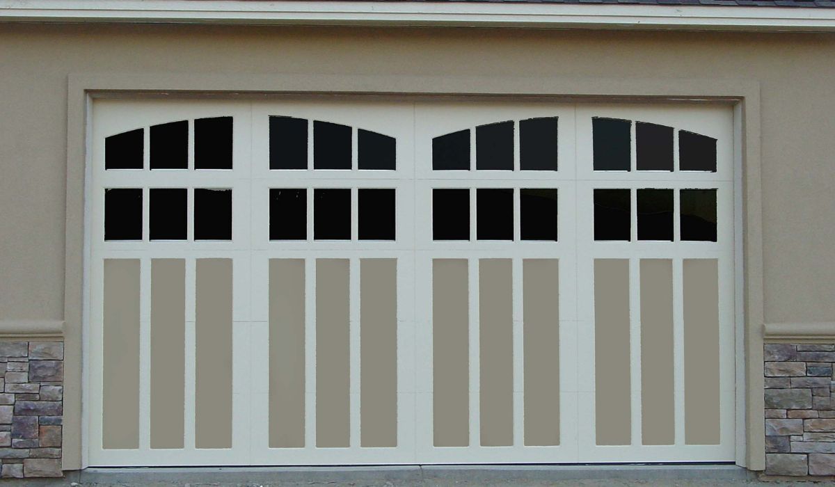 White double garage door with arched windows, set in a beige house exterior with stone trim