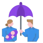 A man and a woman are holding a baby under an umbrella.