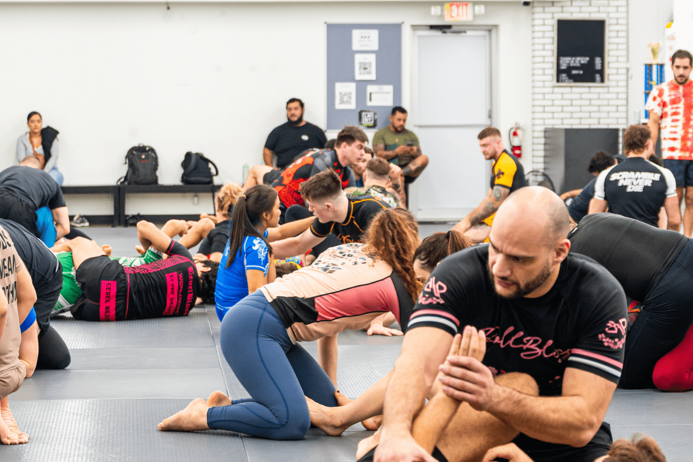 Students practice beginner striking drills at Simple Man Martial Arts in Austin, TX for calm focus and stress relief.