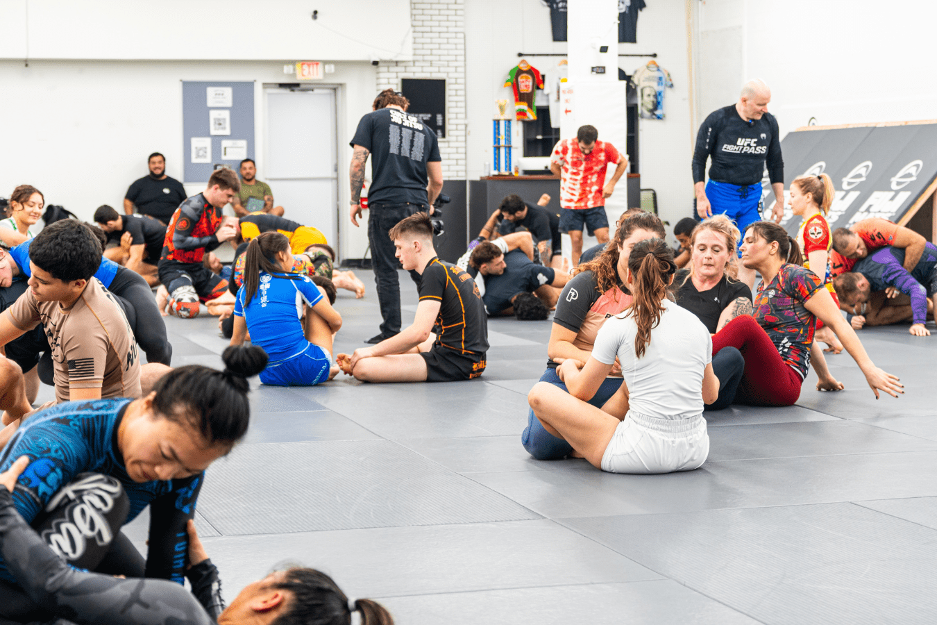 Adults drilling Brazilian Jiu Jitsu at Simple Man Martial Arts in Austin, TX, building skill and community.