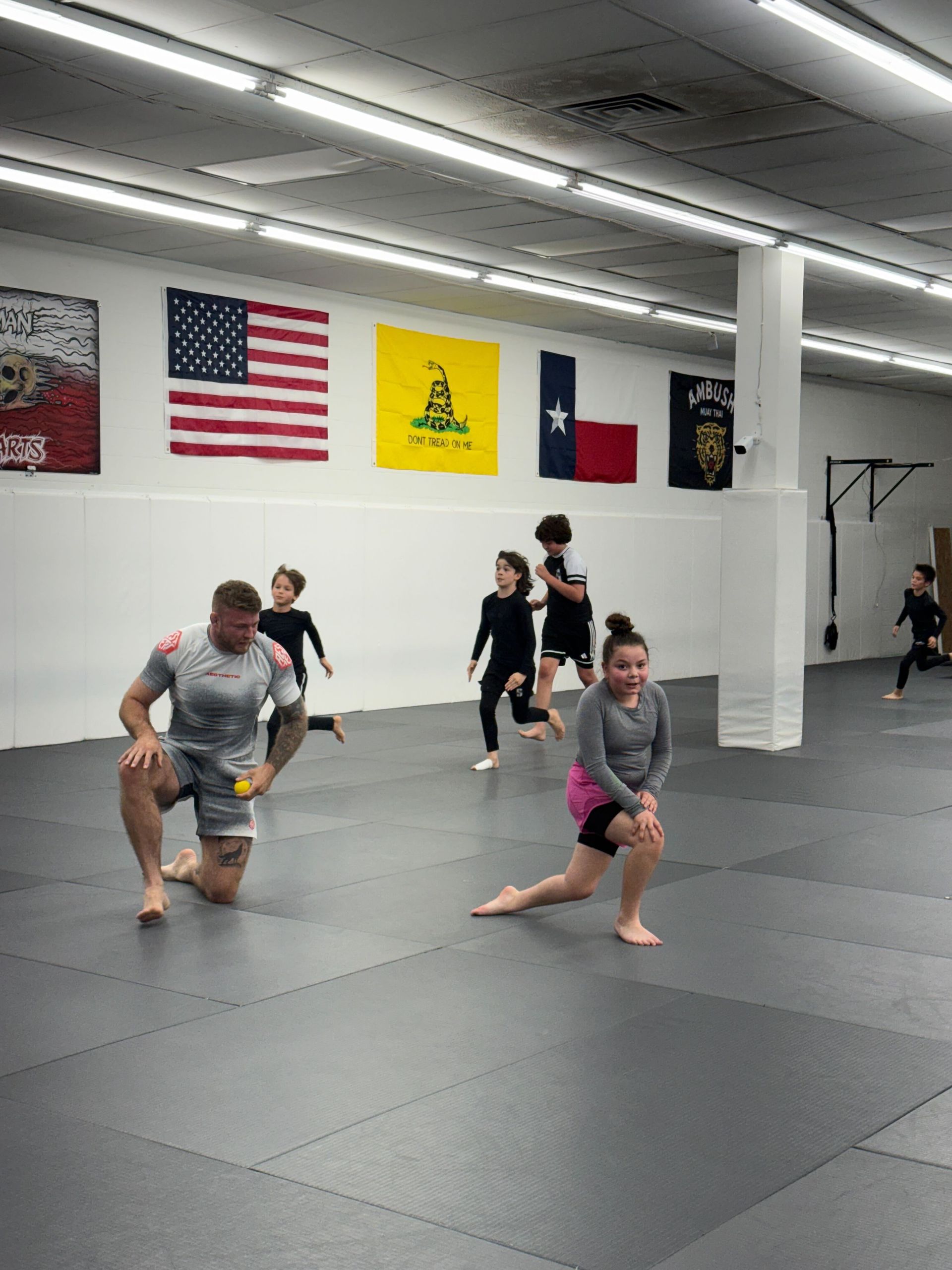 Kids practicing martial arts fundamentals in a safe and supportive environment at Simple Man Martial Arts.
