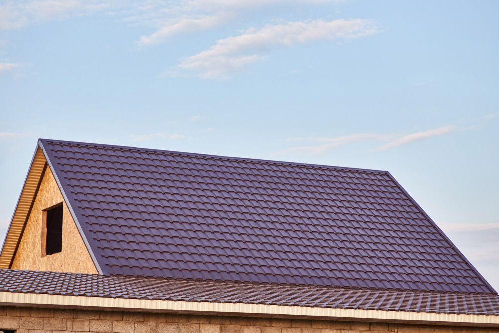 A House With A Brown Roof — Topflite Roofing In Shellharbour, NSW