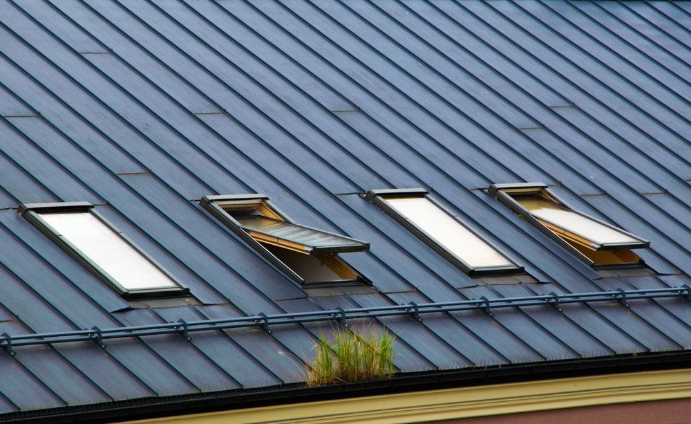 A Roof With A Row Of Skylights On It  — Topflite Roofing In Kiama, NSW