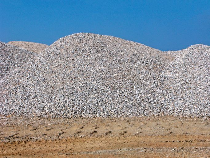 Piles of gravel offered by R. Pepin and Sons Inc., that are used as construction aggregates and materials in Dover, NH.