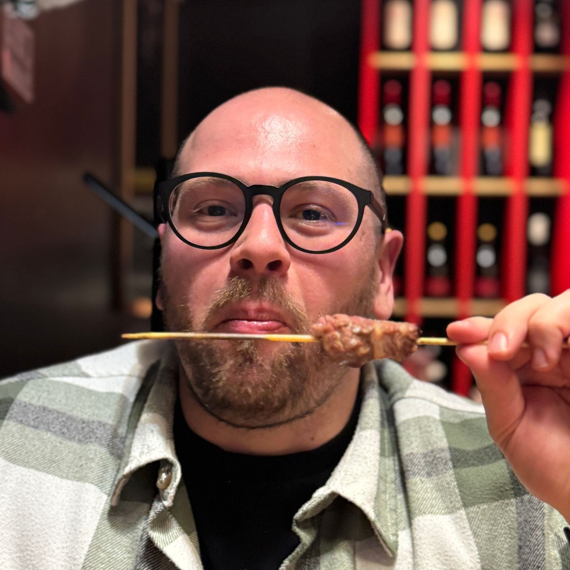 Guido, borGO's founder, is eating arrosticini. A typical food from Abruzzo. 