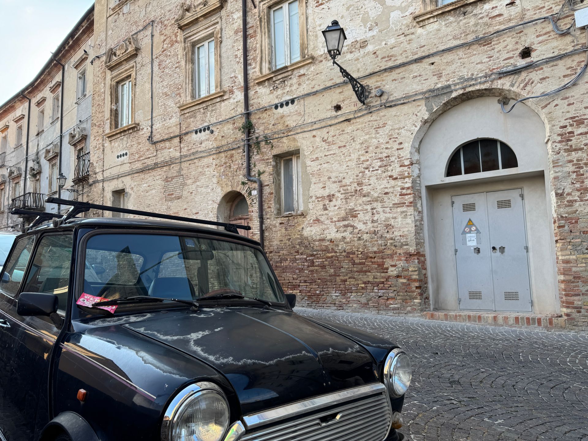 Old car in Penne small center