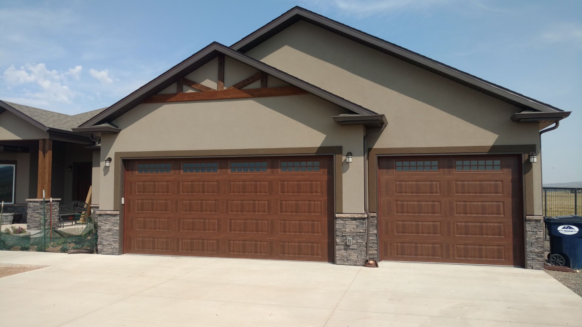 Large House with Two Garage Doors — Laramie, WY — Southeastern Wyoming Garage Doors Large House with Two Garage Doors — Laramie, WY — Southeastern Wyoming Garage Doors