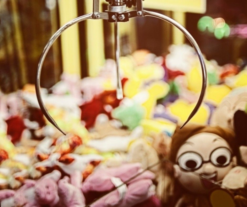 Claw machine full of plush toys