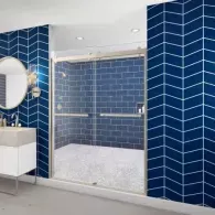 Blue-tiled modern bathroom with glass shower enclosure and white vanity