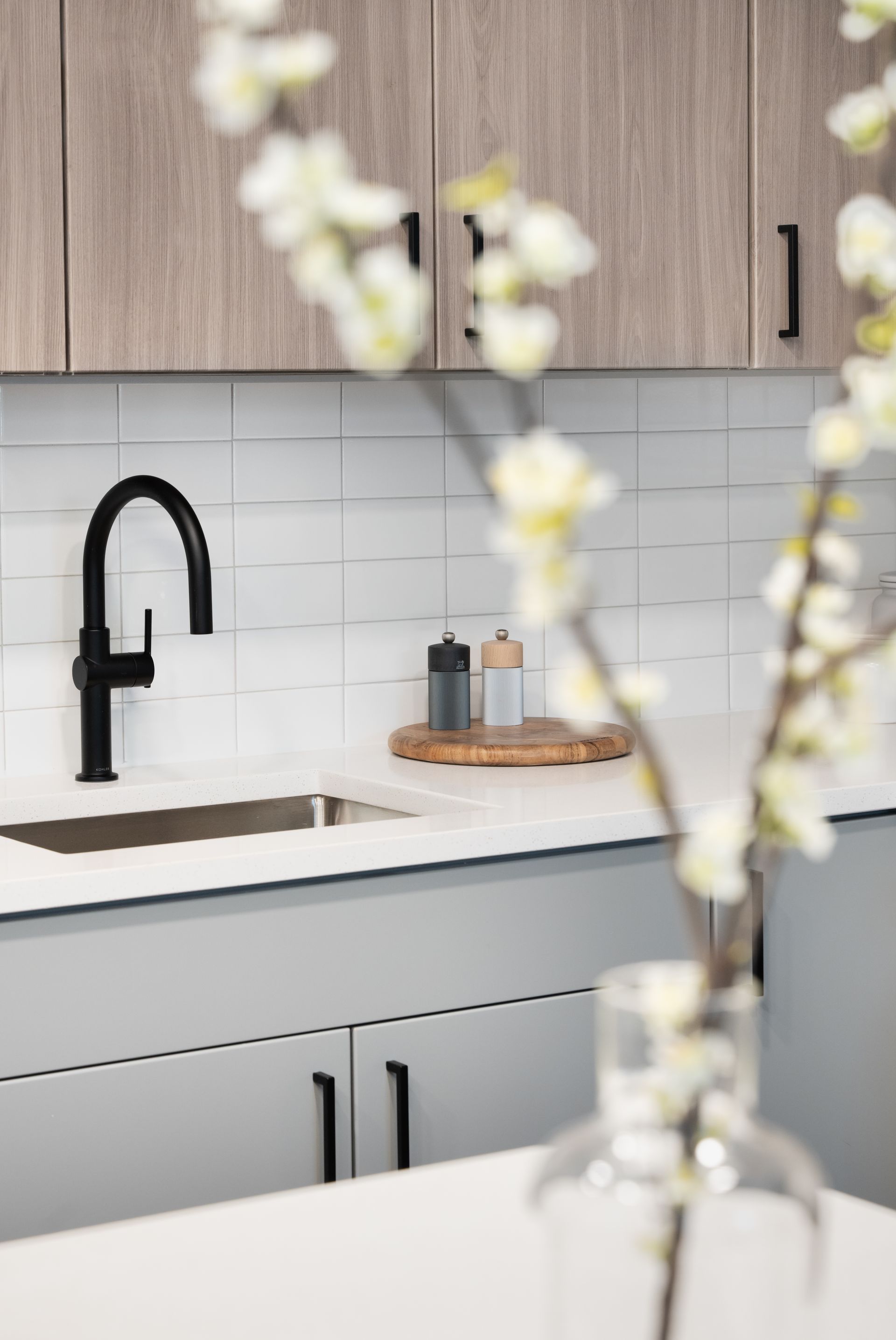 A living room with a couch and two chairs