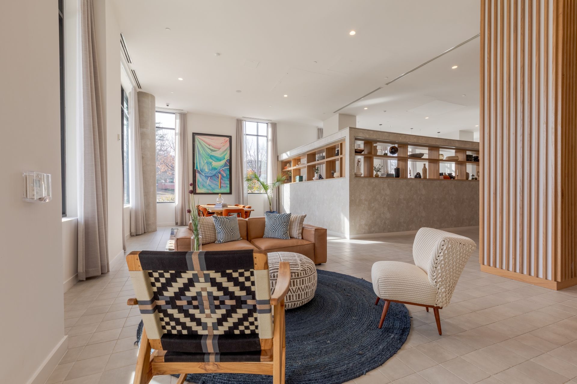 A woman is laying in bed reading a book