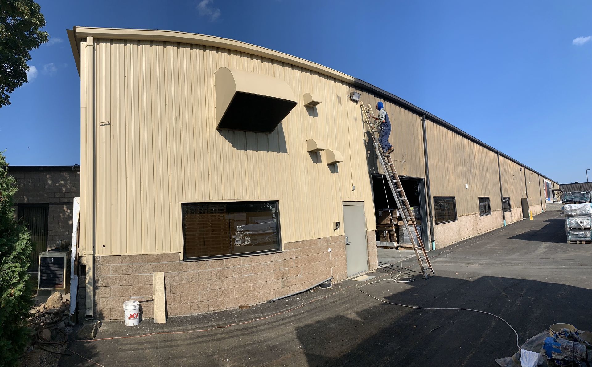 Warehouse exterior painting project by Capital Painters