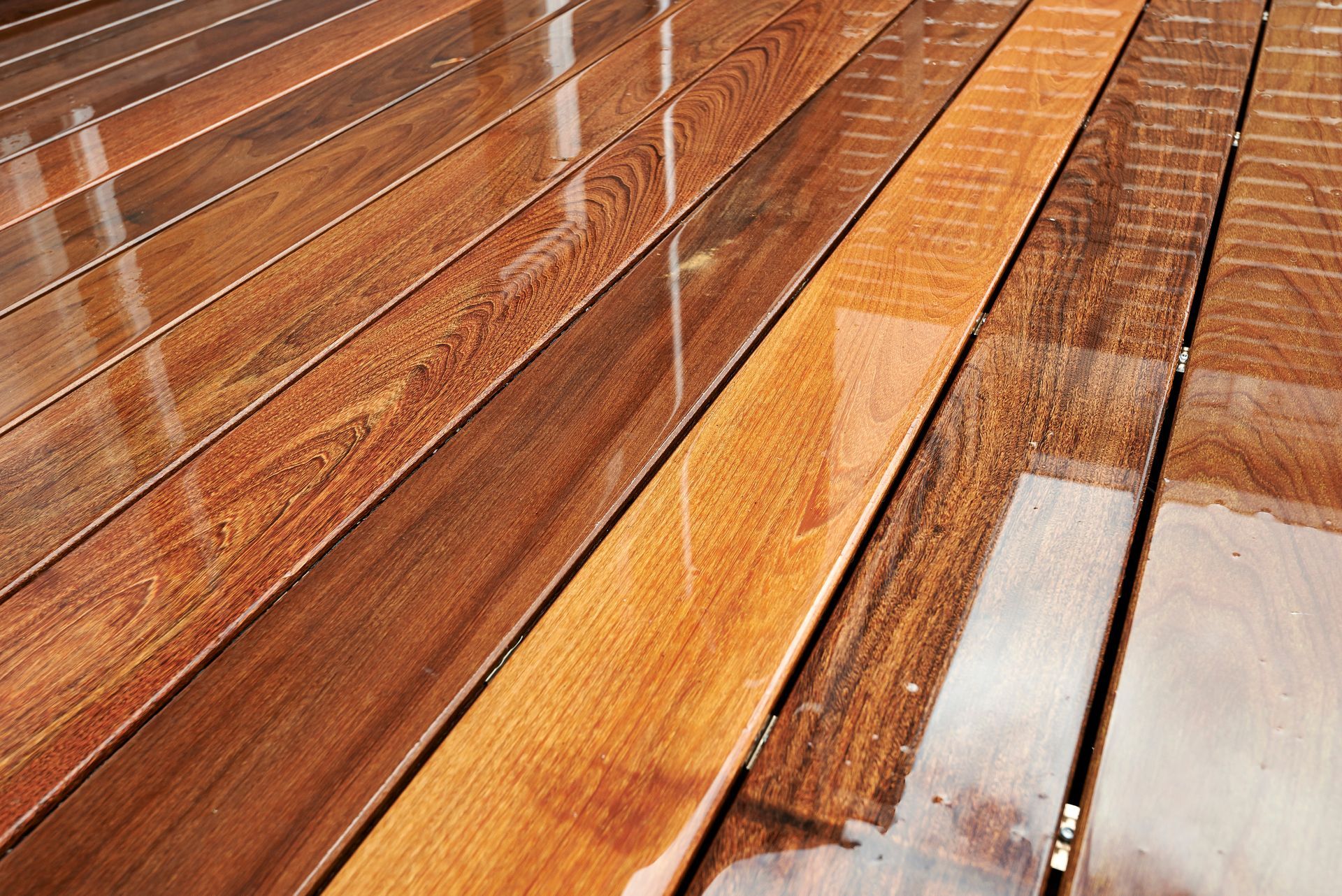 Deck sealing project in Northern CT, applying protective coatings to guard wood from weather while maintaining a natural look.
