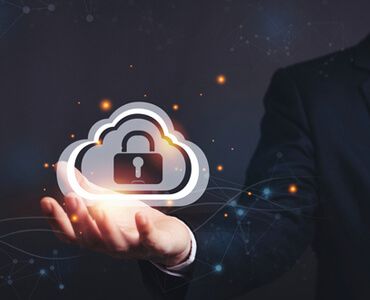 A man in a suit is holding a cloud with a padlock inside of it.