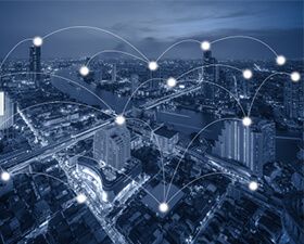 An aerial view of a city with a lot of connections between buildings.