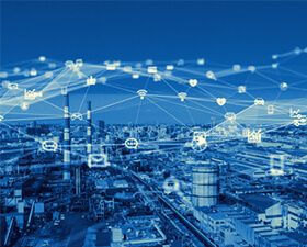 An aerial view of a city with a lot of buildings and a lot of connections.