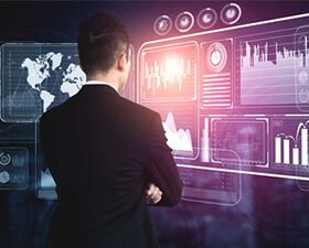 A man in a suit is looking at a futuristic screen.