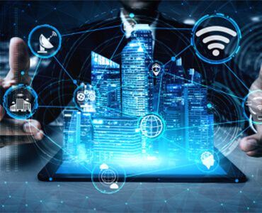 A man is holding a tablet with a city coming out of it.