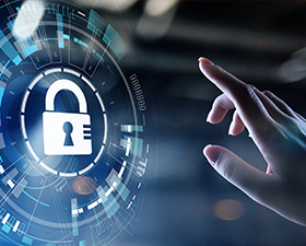 A person is pressing a button with a padlock icon on it.