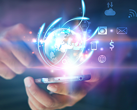 A person is holding a cell phone with a glowing globe coming out of it.