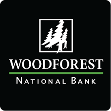 A logo for woodforest national bank with trees in a square