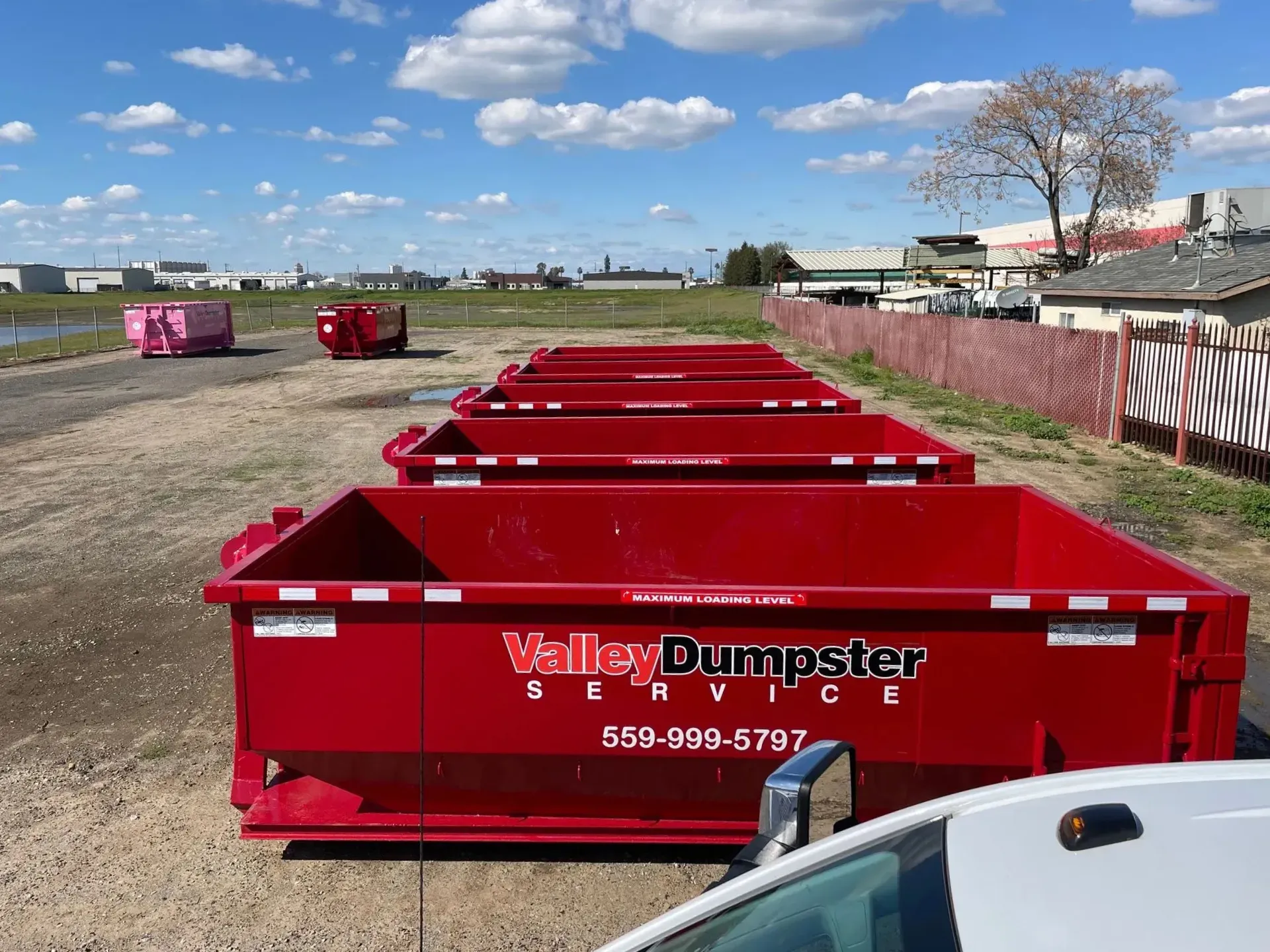 Dumpster rental truck on site