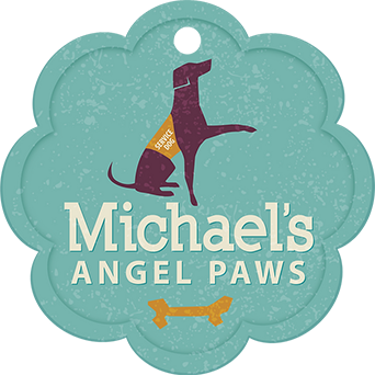 A teal, flower-shaped tag with a dark purple service dog silhouette, yellow bone graphic, and 