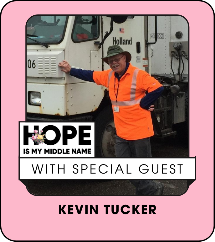 Kevin tucker is standing in front of a holland truck