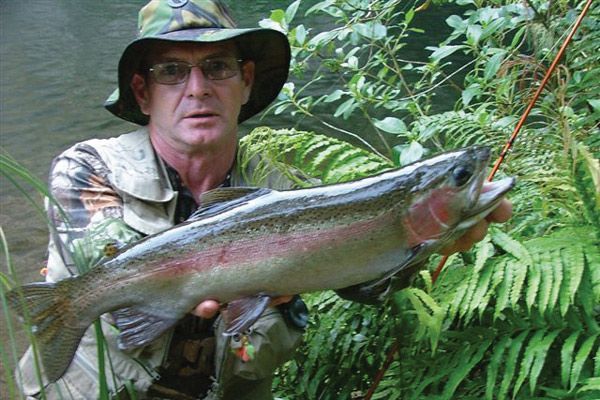 Lindsay the owner with a trout Lindsay the owner with a trout