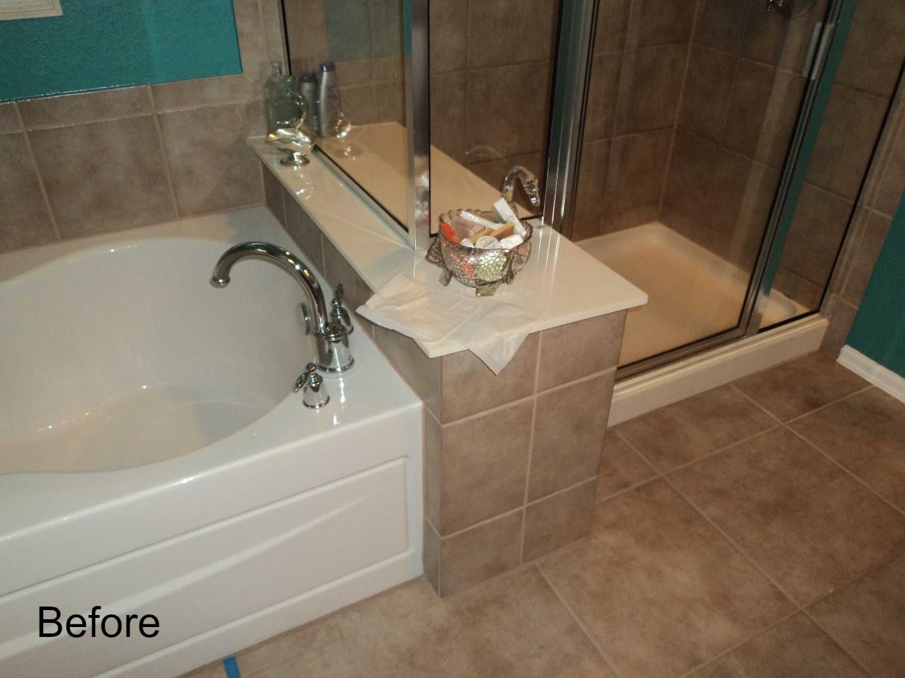 A before picture of a bathroom with a bathtub and shower