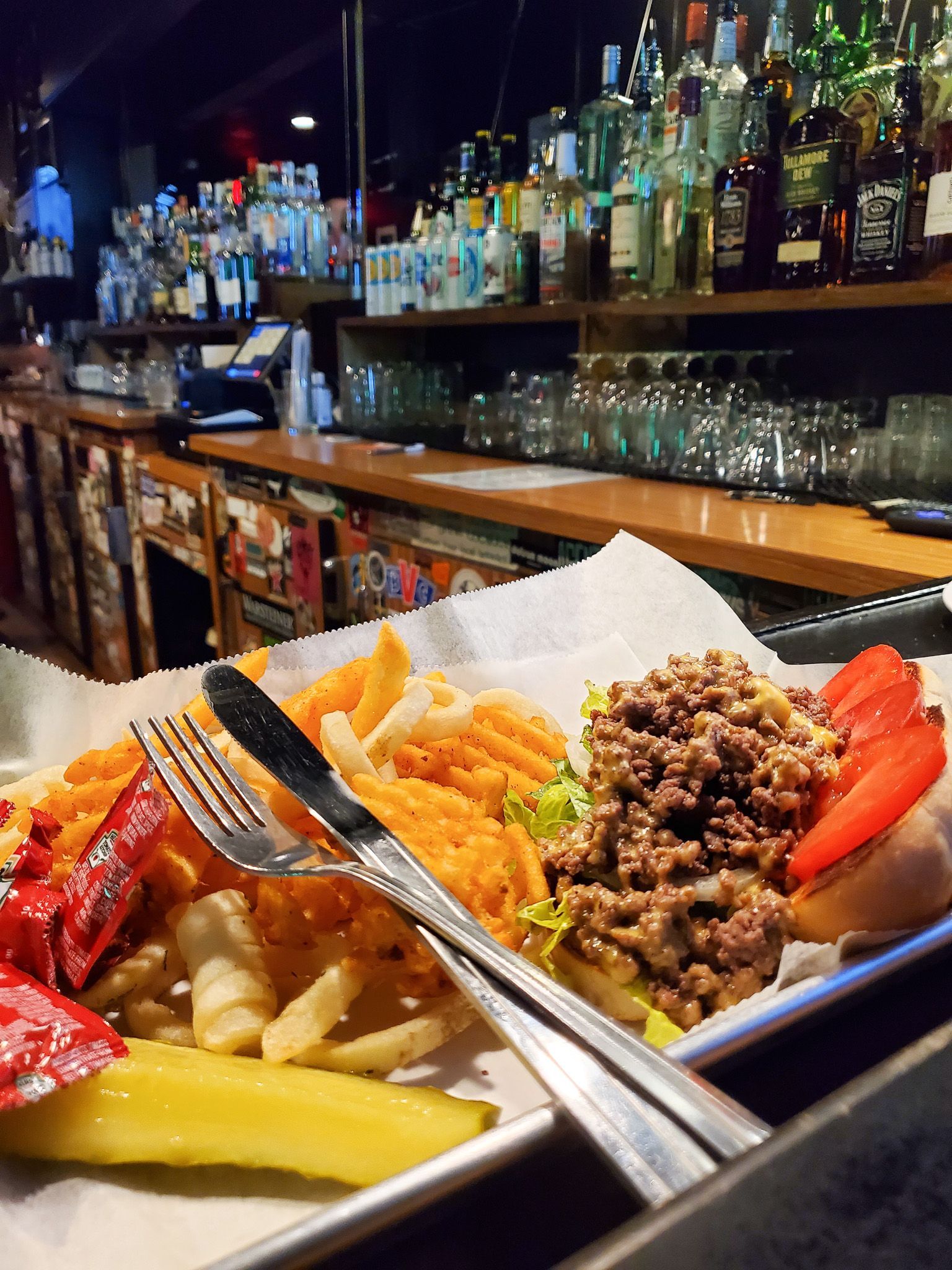 Delicious looking chopped cheese with a side of fries at Bad Ending, a bar in Rochester NY