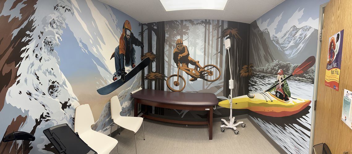 Indoor room with snowy mountain mural, white chairs, a piano, and a hanging chair swing