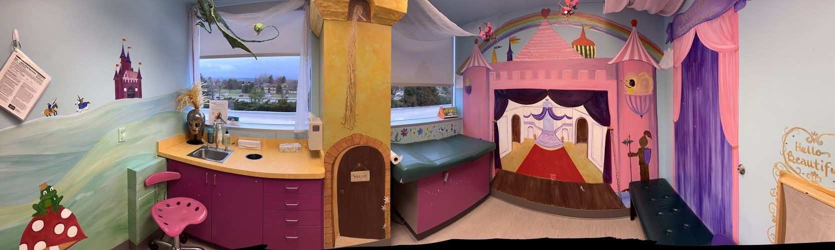 Whimsical pink-and-purple bedroom with a bed, vanity, shelves, and fantasy castle decor