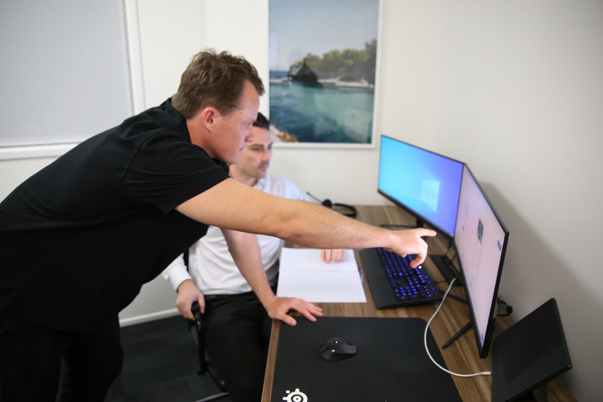 Marketing manager pointing at a computer screen - Digital Marketing Gold Coast QLD