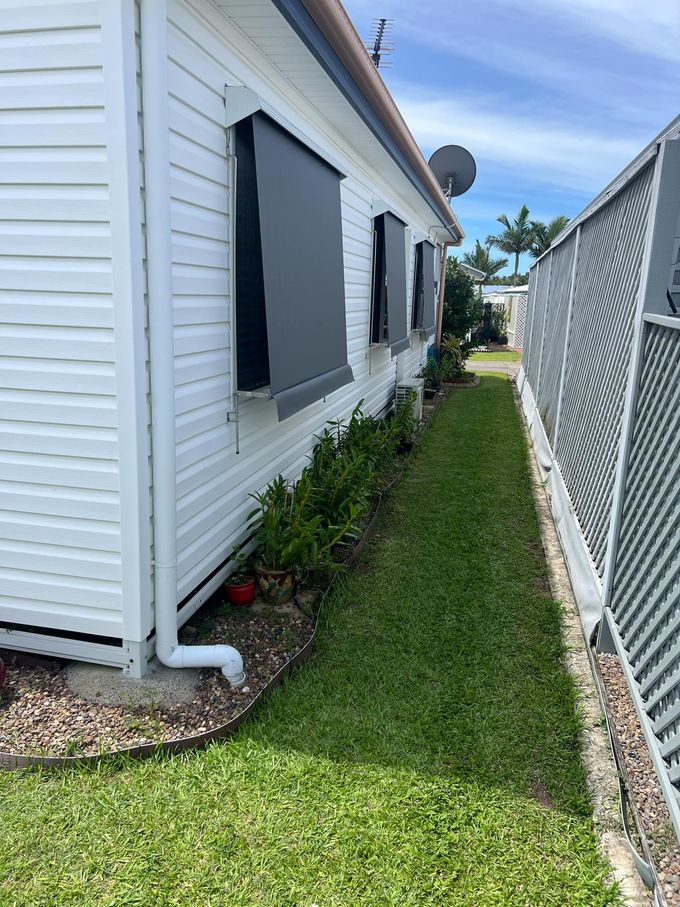 Outside of a White House With Sunblinds — Advantage Screens and Blinds Hervey Bay In Pialba, QLD