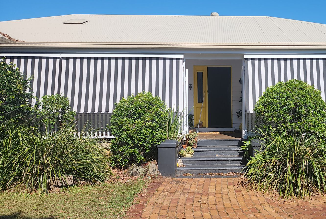 View of A House with Awnings, Door, Path, and Shrubs — Advantage Screens and Blinds Hervey Bay In Pialba, Queensland