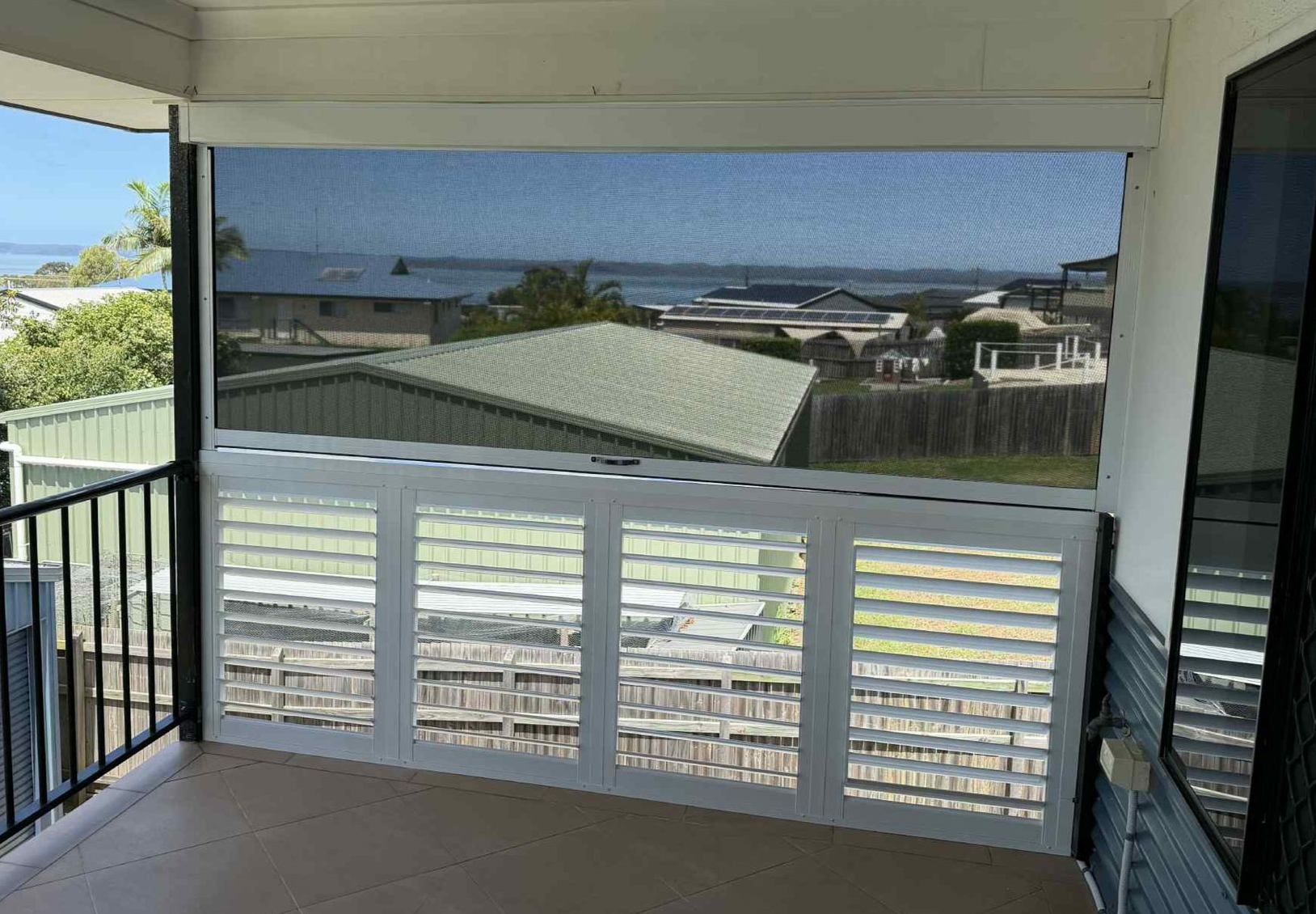Balcony with White Railing and Black Metal Gate — Advantage Screens and Blinds Hervey Bay In Pialba, Queensland