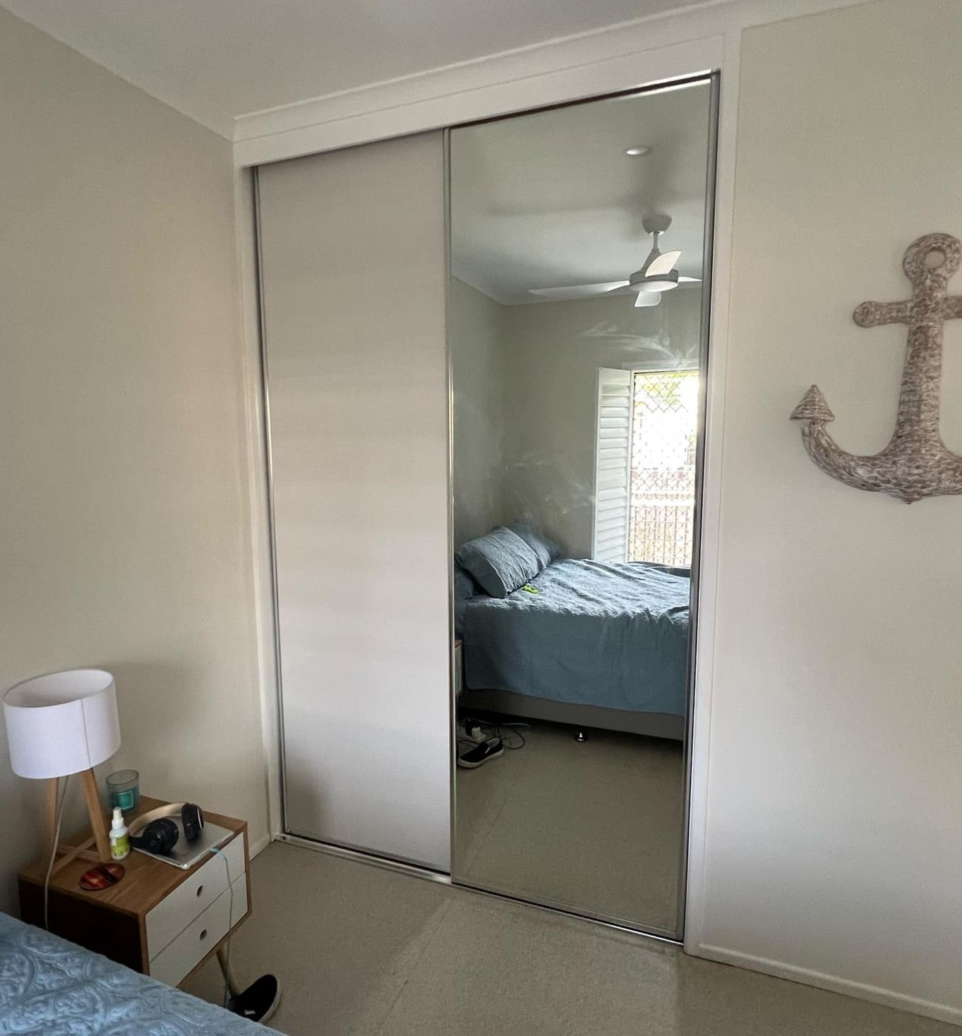 Small Bedroom with Mirrored Closet Doors — Advantage Screens and Blinds Hervey Bay In Pialba, Queensland