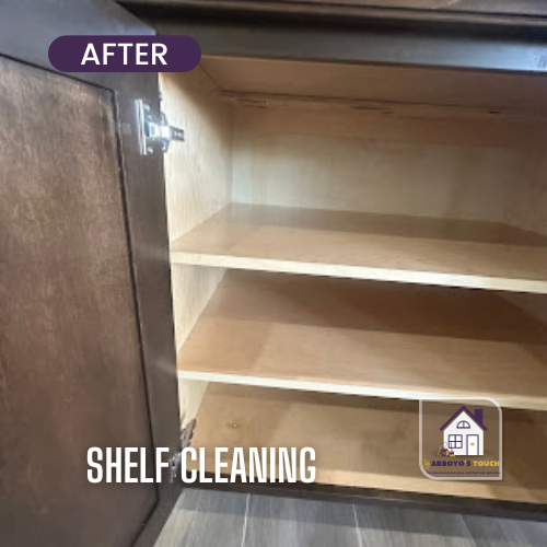 Clean cabinet interior with shelves. Dark wood cabinet door and trim. After shelf cleaning text.