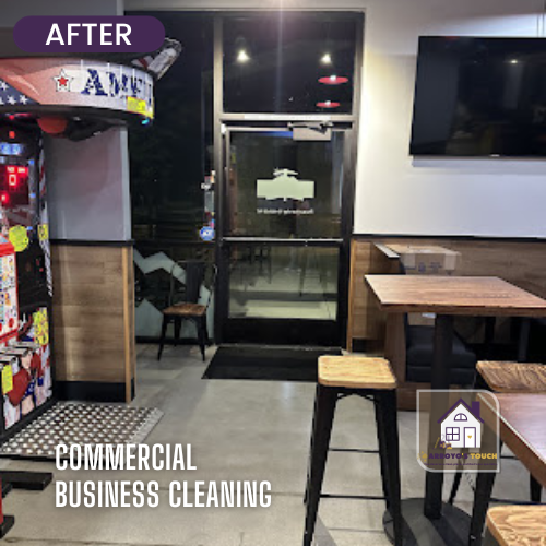 Interior of a cleaned commercial space after cleaning. Includes an arcade game, tables, chairs, and entry door.