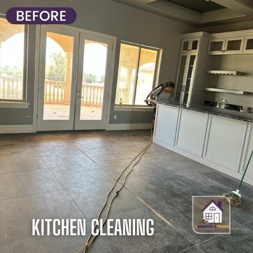 A before photo of a kitchen with unfinished cabinets, French doors, and a person cleaning.