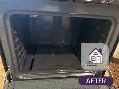 Clean oven interior with the door open, showcasing its pristine condition post-cleaning.