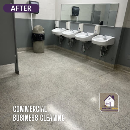 Cleaned commercial bathroom with sinks, mirrors, and trash can. Gray floor and walls.