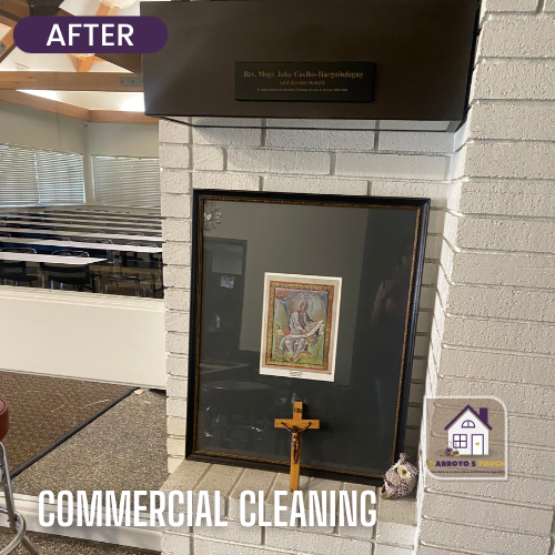 After commercial cleaning of a church fireplace, with framed art, cross, and a religious statue.