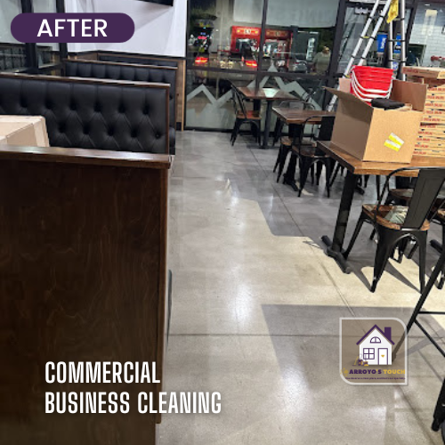 Clean commercial space with booths, tables, and shiny floor.