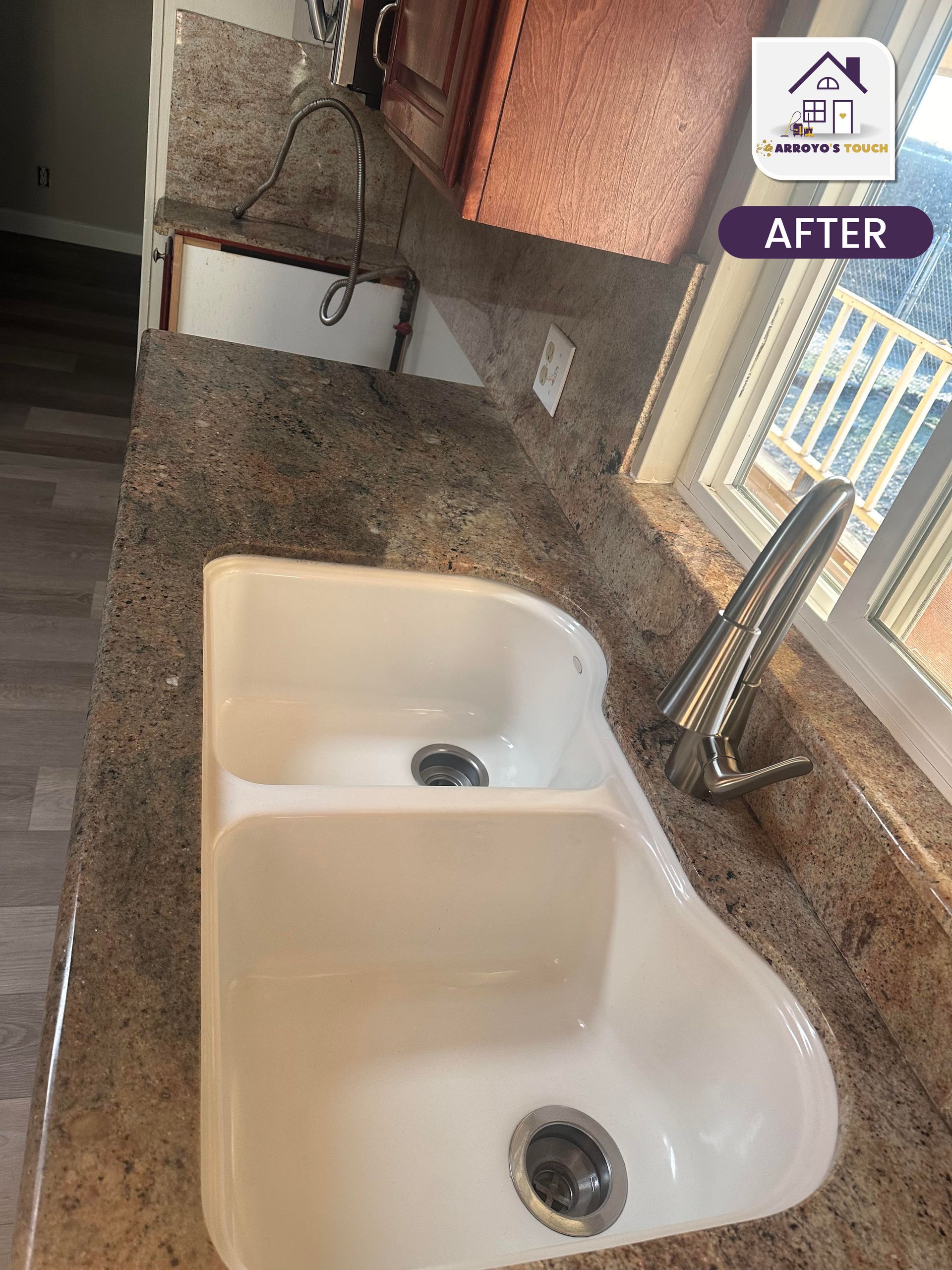 Newly renovated kitchen sink with granite countertop and window.