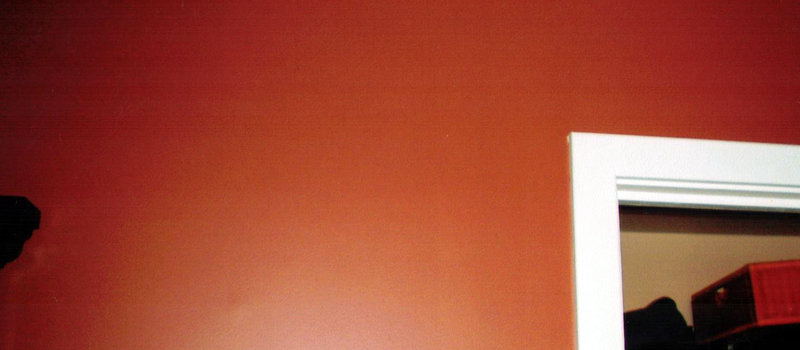 interior wall of home painted a deep orange with white trim