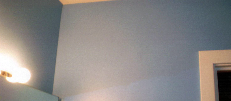 interior corner of home painted light blue. 